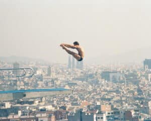 Scott Donie competes in the 1992 Olympics, high above the city of Barcelona. Photo Credit: Rol Donie.